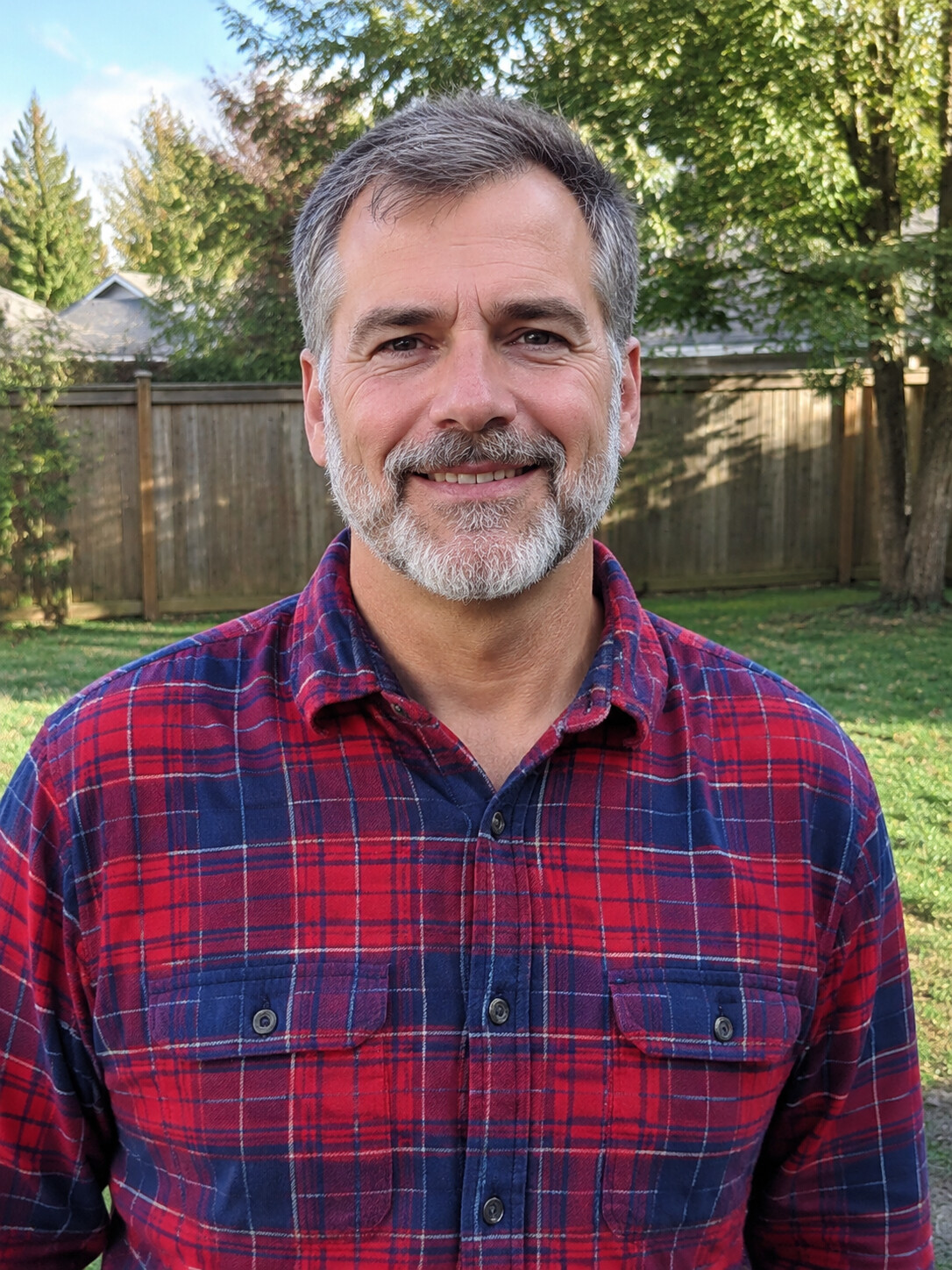 Source photo of a fifty-something dad with a gray beard in a red-and-navy flannel shirt